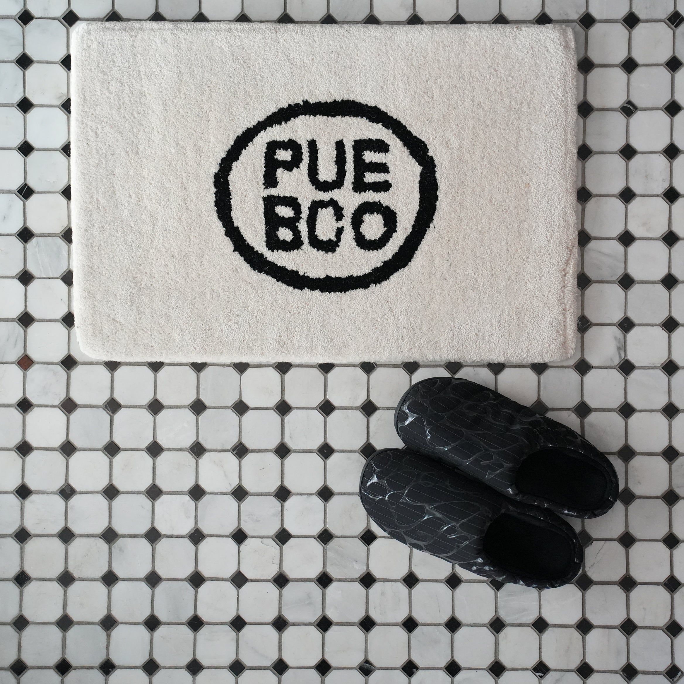TUFTED MAT / PUEBCO LOGO